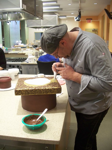 J rg Amsler piping chocolate on his version of a royal wedding cake Photo 