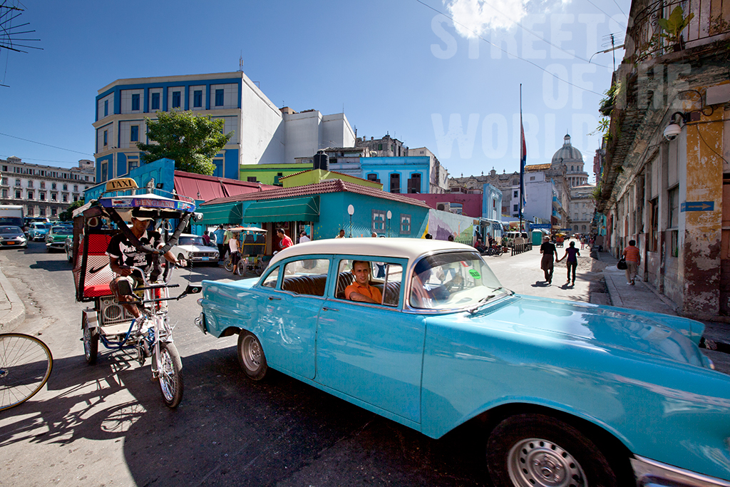  bustling streets are filled with classic American cars