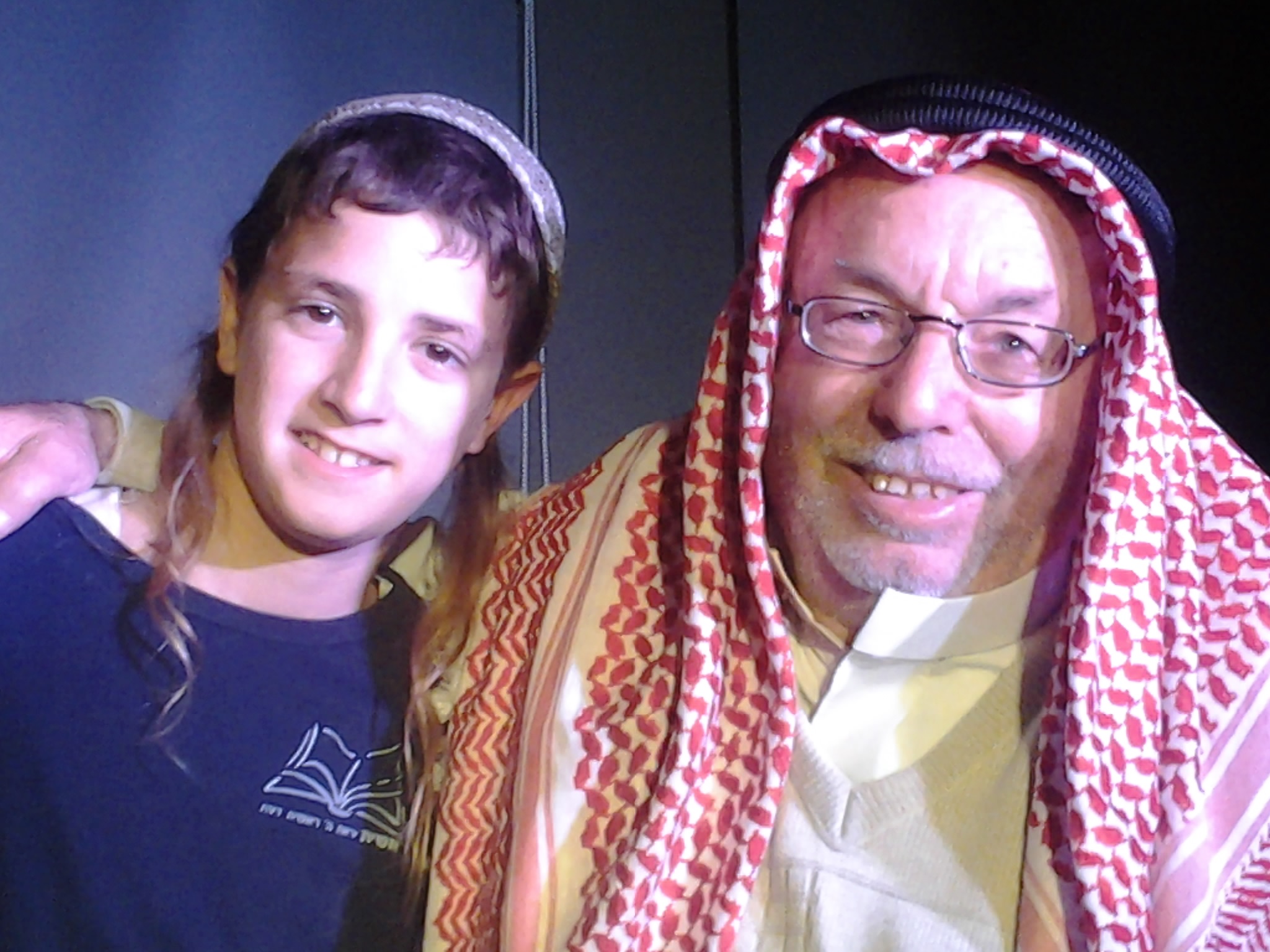 Photo Credit: Tazpit News Agency / Rabbi Froman&#39;s grandchild with Sheikh Ibrahim Ahmad Abu El-Hawah. - 2014-03-10-SheikhIbrahimandRabbiFromansgrandchild