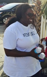 Tohlia McCullough handing out bottled water