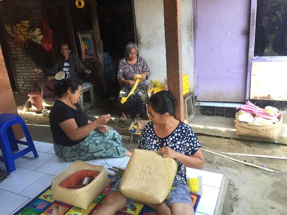 Local Villagers work on handmade crafts