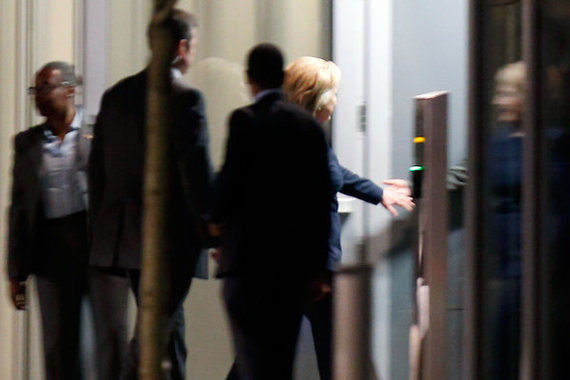 Clinton enters the Franklin Square Capital Partners headquarters through a back entrance. Credit: Yong Kim