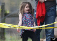 Suri Cruise Has Fun With Security Tape (PHOTOS)