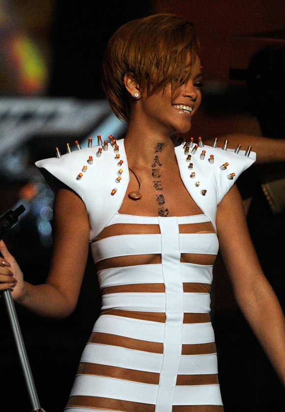 Rihanna plugged her upcoming "Rated R" album with a (fake) tattoo of the 