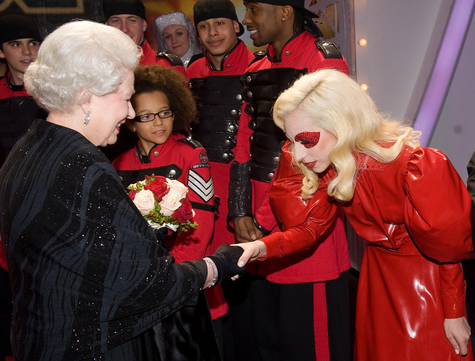  night in London as she met Lady Gaga, who wore red leather and curtsied, 