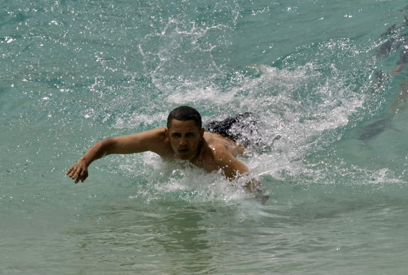 President Obama bodysurfing