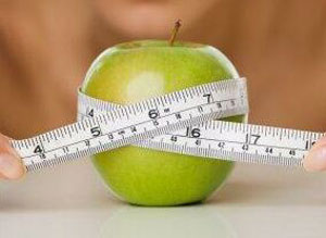 losing weight apple tape measure photo