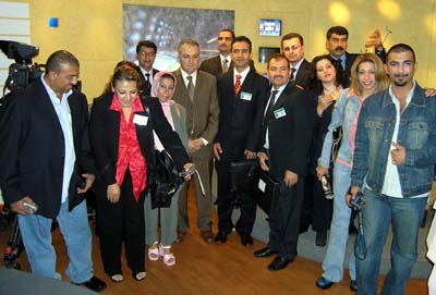 2011-08-19-1WalidAbboudinstripedbrownsuitwithIraqijournalistsatLBCAbuFadil.jpg