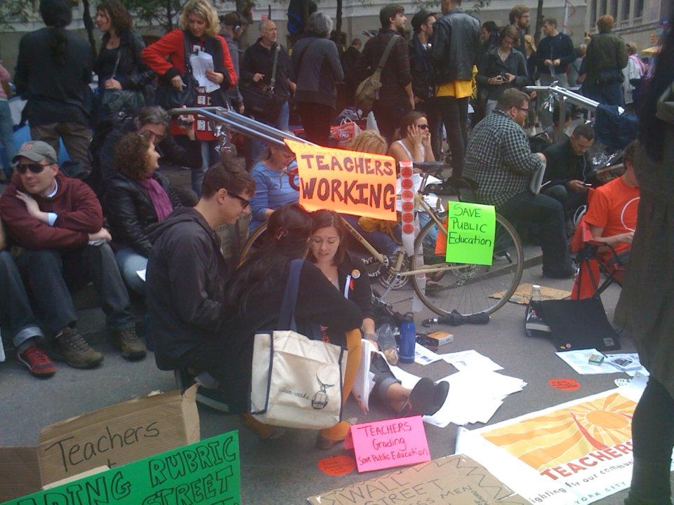 2011-10-06-OccupyWallStreet_TeachersGradingPapers.jpg