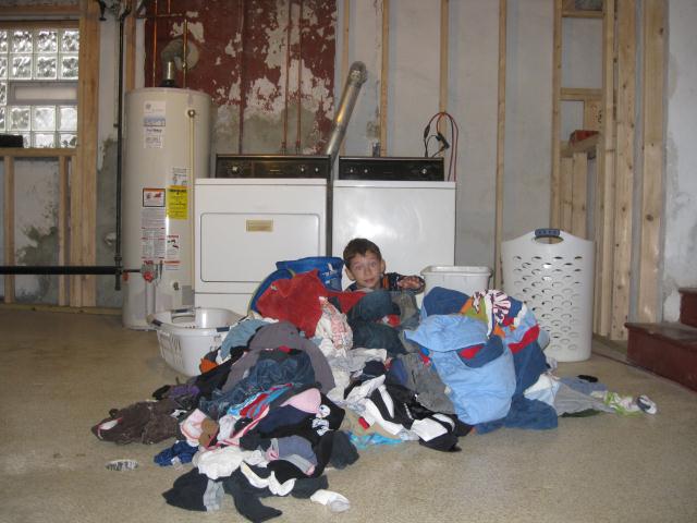 2012-01-26-8yearoldburiedinlaundry.jpg