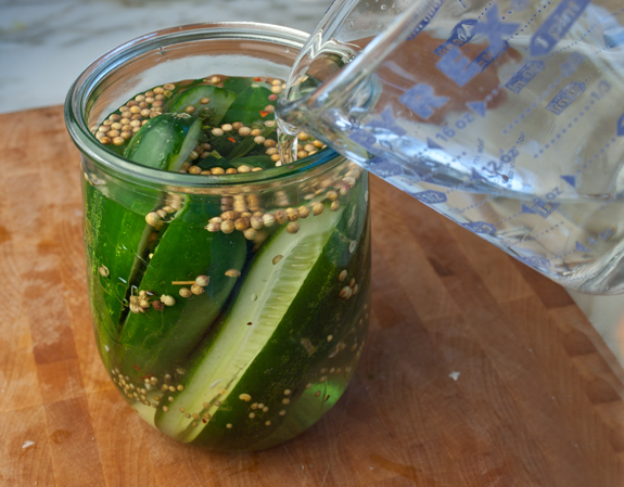 2012-05-17-pouringbrineoverpickles.jpg