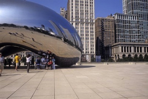 2012-08-07-12028911touristsunderthecloudgateinmillenniumparkchicagoillinoisusalookatreflectionsinthebea.jpg