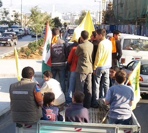 2013-02-05-LebaneseyouthcarryingpoliticalpartyflagsAbuFadil.jpg