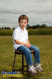 2013-03-07-jacobsittingonchairinfield200x300.png