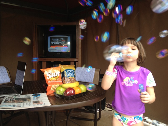 2013-05-08-ErysseBlowsBubblesInCabana.jpg