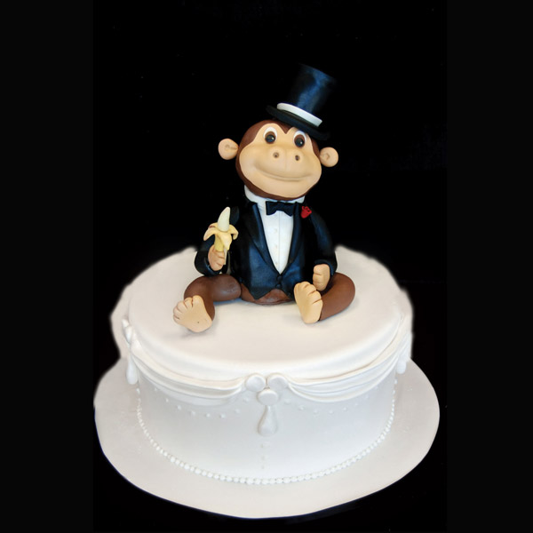 2013-06-11-2monkeycaketopper_pinkcakebox.jpg