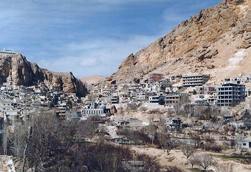 2013-07-19-MaaloulasurroundedbycavernswhereearlyChristianshidfromRomansAbuFadil.jpg