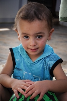 Nouras, a toddler living in Jordan. His parents fled the violence in Syria and are now expecting their second child.
