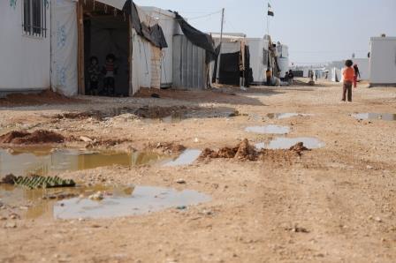 Children play in the puddles of Za'atari Camp. World Vision will be working with UNHCR and other agencies to improve drainage and roads.