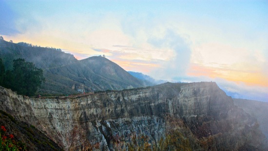 clouds pull back from the Kelimutu volcano