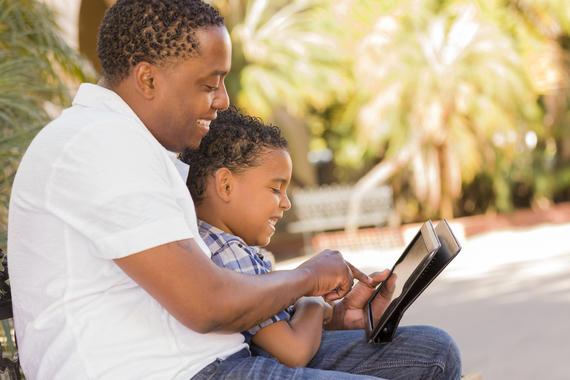 2014-09-01-dadandboyplayingontabletshutterstock.jpg