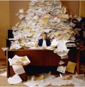 2014-11-25-woman_with_desk_paper_covered.png