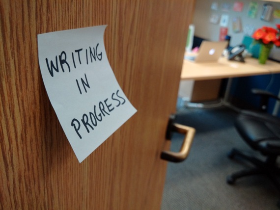 Office door with post-it note - Writing in progress - photo credit Carmi Levy