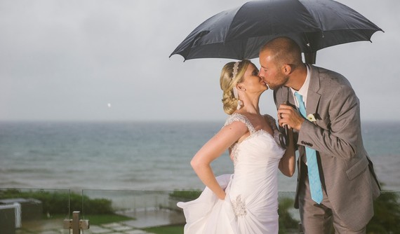 2015-03-03-JaclynandTimkissingundertheumbrellaEA.jpg