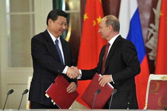 2015-04-26-1430008851-4540631-Xi_Jinping_and_Vladimir_Putin__EDM_September_17__2013.jpg