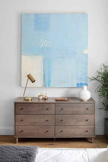 Midcentury-style dresser vignette with brass and copper accents by Decor Aid
