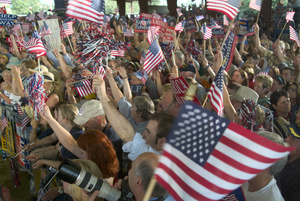 2015-06-10-1433898516-5236602-people_waving_the_flag_at_a_political_rally_0001040820112207_SMU1.jpg