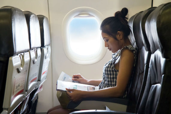 2015-06-16-1434489859-1577779-WomanReadingonPlane_800px.jpg