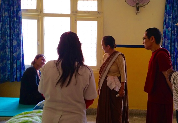 2015-06-17-1434576160-8914270-Rinpoche_clinic_visit.jpg