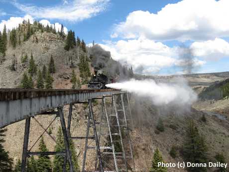 2015-06-30-1435707855-5084979-Cumbres_Toltec_Scenic_Railroad_26_train_blowing_steam_on_bridge.jpg