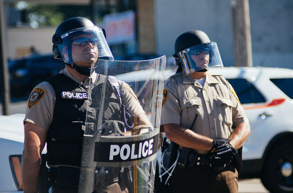 2015-09-06-1441563758-4177017-CWCONSTANCEHUFFPOBLOGPolice_in_riot_gear_at_Ferguson_protestsfergusonwikimedia.jpg