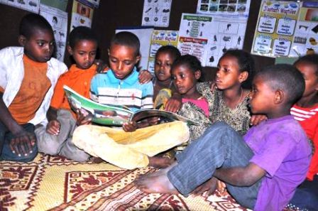 2015-09-07-1441654629-8008951-Literacyreadinggroup.jpg
