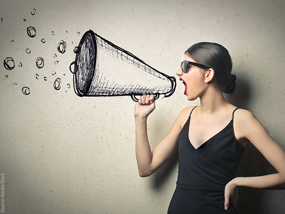 Woman speaking into a megaphone