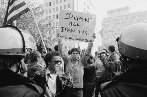 2015-12-14-1450082419-2532817-Man_holding_sign_during_Iranian_hostage_crisis_protest_1979.jpg