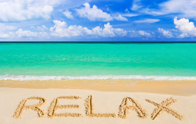 relax written on beach