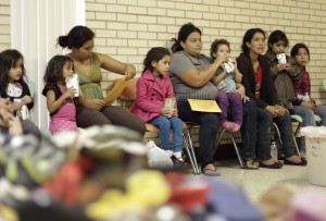 2016-01-04-1451937989-596435-MigrantssitinshelteratCatholicchurchinTexas300x203.jpg