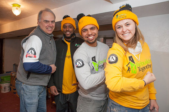 AmeriCorps Director Bill Basl and AmeriCorps members with Rebuilding Together take a photo break during the 2014 Martin Luther King Jr. Day of Service.