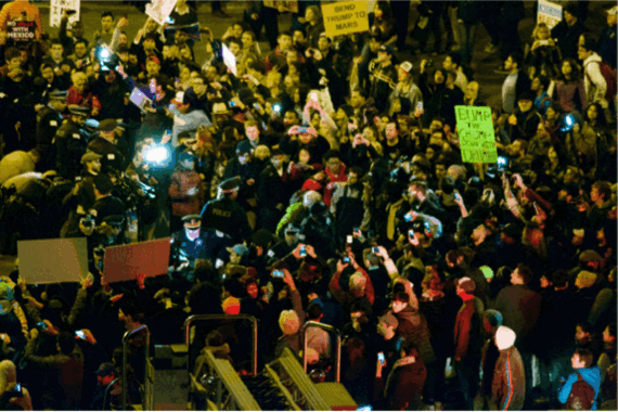 2016-03-16-1458090724-8674801-Trump_protest_Chicago_March_11_2016flickr605w.gif