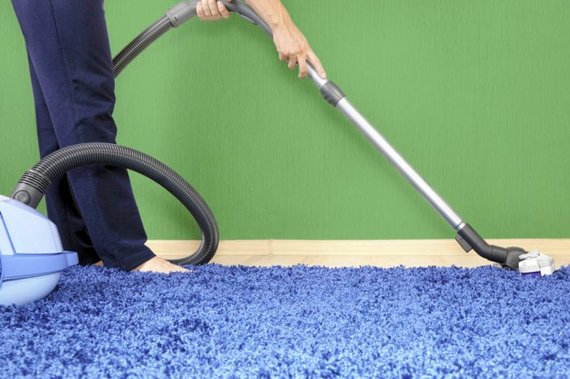 Angie's List Service Provider vacuuming carpet