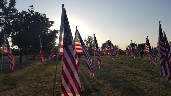 2016-05-27-1464379981-4159474-FlagsatSunset2015.jpg