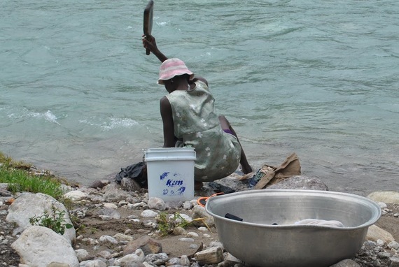 2016-10-09-1476055702-8384613-Haitiwashwoman.JPG