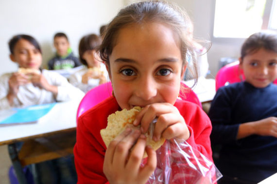 2016-11-22-1479819295-2667104-SyriangirleatsTheirworldsnackatMteinSchoolinLebanonpictureTheirworldHusseinBaydoun.JPG