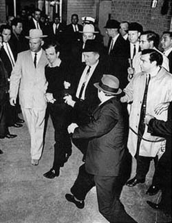 2017-01-23-1485194187-4430036-Lee_Harvey_Oswald_being_shot_by_Jack_Ruby_as_Oswald_is_being_moved_by_police_1963250px.jpg