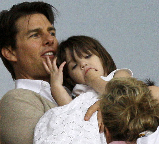 Katie Holmes flashes her boob at tea with Suri as Tom Cruise hits back